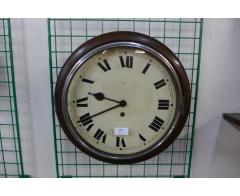 A mahogany circular wall clock