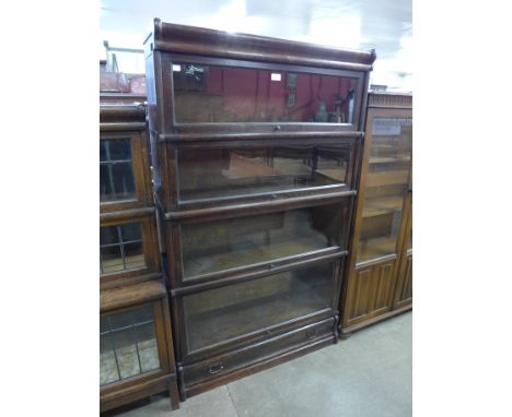 A Globe Wernicke oak four tier sectional bookcase