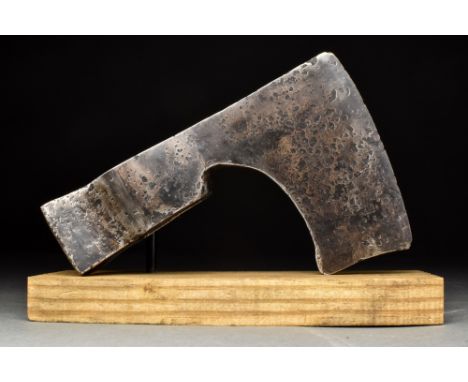 Ca. 900-1000 AD  A forged-iron axe head of a sizeable form with a lengthy neck, a verticle blade with flared tips, and a wide