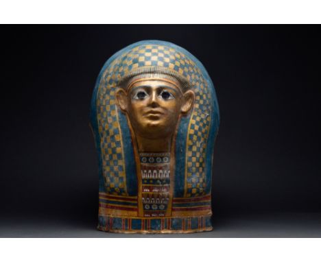 Ptolemaic Period, Ca. 332-30 BC. A brightly painted in polychromy cartonnage mummy mask made from layers of linen covered wit