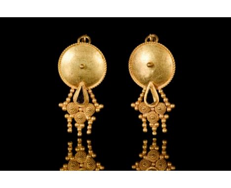 Ca. 100-300 AD  A pair of gold earrings, each comprising a suspension loop, circular upper plate with a raised central boss a