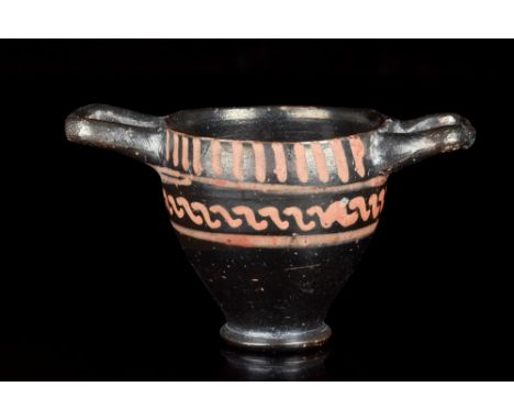 Apulia, Ca. 2nd half of the 4th Century BC A beautiful skyphos portraying typical decoration of Xenon ware style. The cup fea