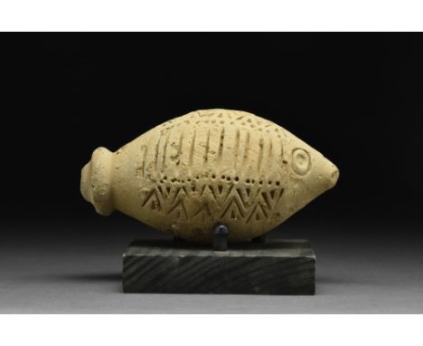 Ca. 900-1200 AD  A decorated "fire grenade" comprising a ceramic vessel with impressed geometric decoration and a pointed bas