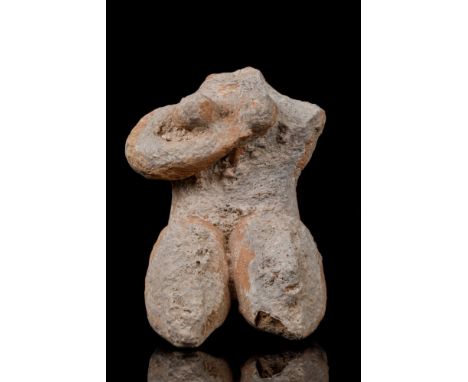 Ca. 5000-4000 BC  A terracotta female fertility idol of a rather curvaceous body, depicted in a seated position with upraised
