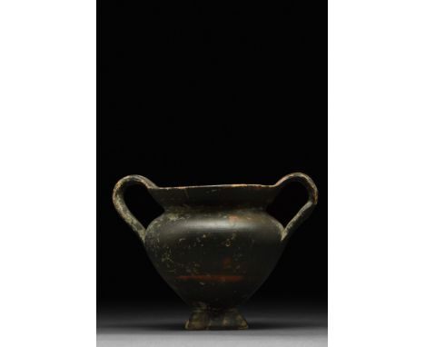 Ca. 2nd half 4th - 1st half 3rd Century BC  A wheel-thrown pottery kantharos (wine cup) with a footed concave base, bulbous b