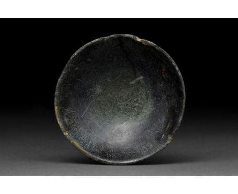 Ca. 3rd Millennium BC  A skillfully carved stone bowl, featuring a hemispherical body with walls flaring outwards, creating a