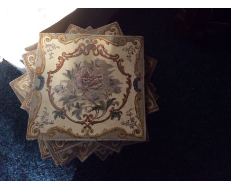 Fourteen decorative ceramic tiles with Classical style flower pattern.
