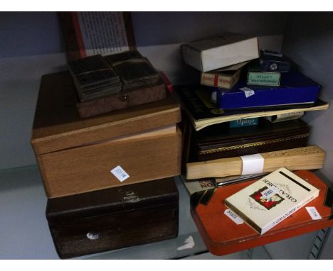 Lot to include playing cards, cigarette cards, a fan, a cigarette lighter.