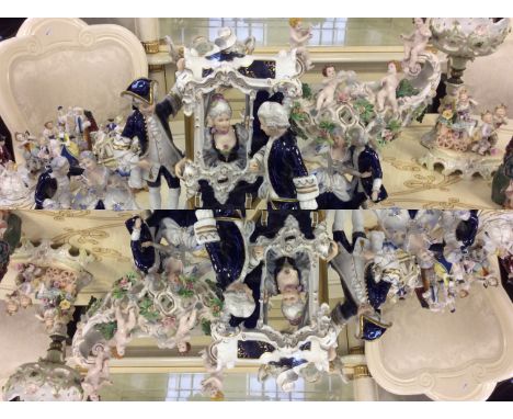 A large blue, white and gilt figurine group together with a selection of ceramic figures and a decorative bowl.