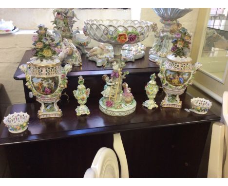 A selection of ceramic items to include decorative urns and a floral centre piece.