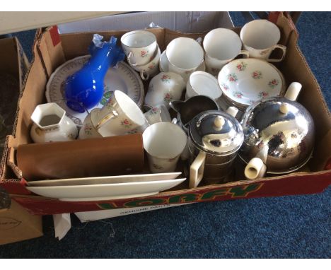 Two boxes of assorted items including a Duchess China tea set, metal and ceramic tea pots and blue glass vase.