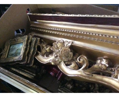 A box of gilded gilt effect shelves and gilded framed prints.