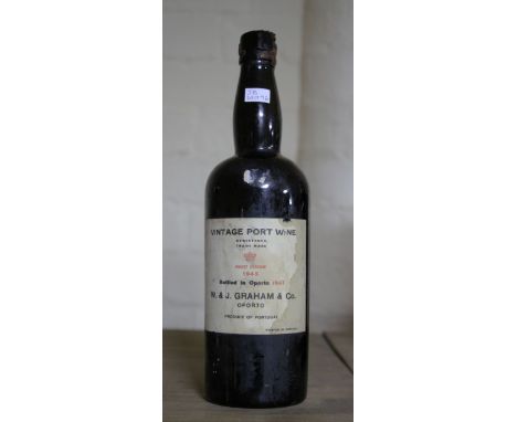Grahams Vintage Port 1945. Slight damage to wax seal. Good label condition, slightly stained. Top shoulder fill level.