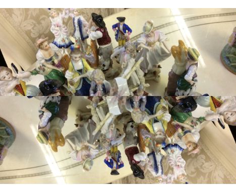 A selection of fifteen ceramic figurines to include boy with basket of flowers, courting couple and farm lady.