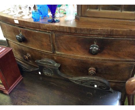 A Victorian mahogany veneered bow fronted chest of drawers with three long two short drawers.