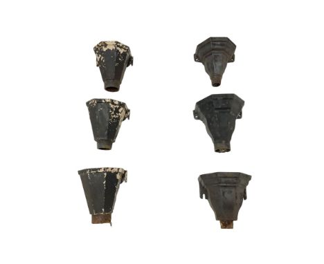A harlequin set of six late 19th to early 20th century iron rainwater hopper heads