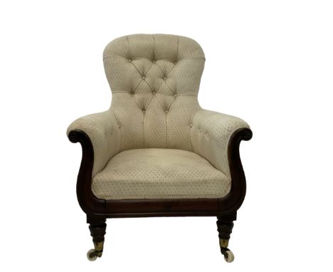 William IV rosewood framed library armchair, spoon shaped back with scrolled arms carved with rosette decoration, upholstered