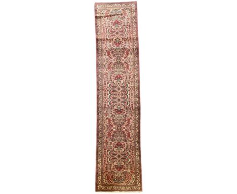 Persian rose ground runner rug, symmetrical pole medallion with interconnecting geometric flower heads, the field decorated p