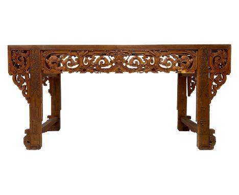 Large 19th century Chinese hardwood altar table, rectangular top over frieze pierced and carved with scrolls and dragon heads