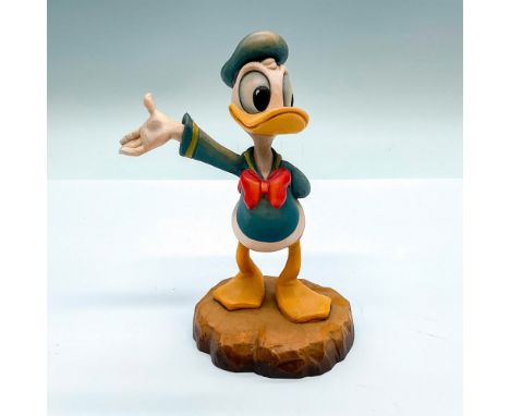 Limited edition. A vintage carved figure of Donald Duck hiding a flower behind his back. Limited edition number 493/500 carve