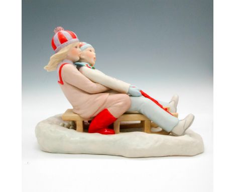 Matte finished figural of children on sled in winter clothing on snow. Cybis raised mark. Issued: 20th centuryDimensions: 9"L