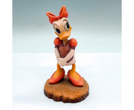 Limited edition. A vintage carved figure of Daisy Duck waiting for a surprise. Limited edition number 282/500 carved on the u