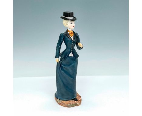 This fine china figurine is part of the Edwardian Services collection and is modeled after a refined lady dressed in her exqu