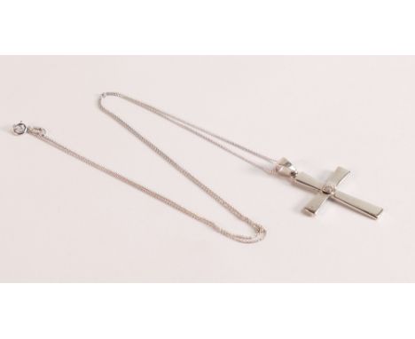 10ct White Gold Cross with Diamond on a 10ct Chain
both stamped 10K.  Cross dimensions are: 20mm by 30mm.  Chain length is 20