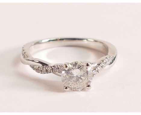 Platinum and diamond ring with diamond twist shoulders
The brilliant cut Diamond measures 6mm, carat weight is 0.80ct, colour