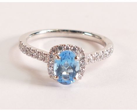 Oval Aquamarine And Diamond Platinum Ring
 - Aquamarine stone dimensions 7.15mm x 5.25mm.  Diamond Halo and Diamond shoulders