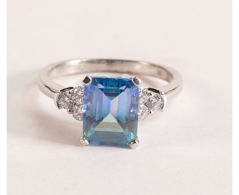 9ct White Gold Ring with Blue Green Topaz and Diamonds
This stunning blue green Topaz is emerald cut, measuring 9mm by 7mm, 2