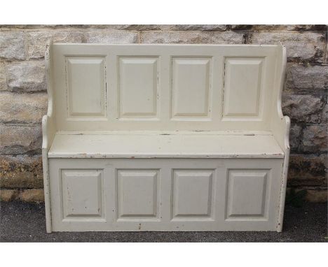 A Cream-Painted Kitchen Bench. The bench with lift-up top, approx 115 cms w x 90 cms h.