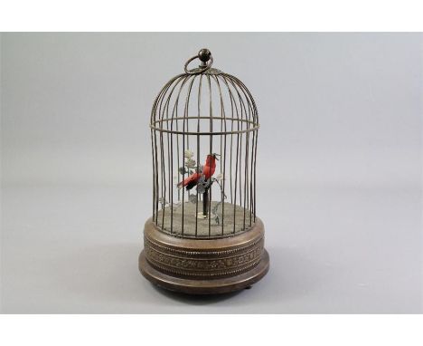 Early 20th Century Brass Singing Bird Automaton. The bird perched on a bar within the birdcage, the little red bird charmingl