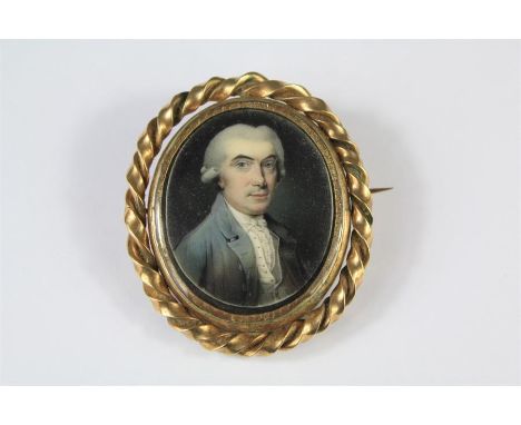 A Fine 9ct Georgian Mourning Brooch/Portrait Miniature. The oval portrait depicting an unknown gentleman in period dress and 