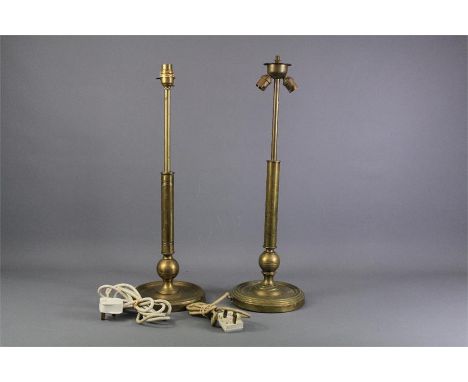 A Pair of Military Brass Lamp Stands. The stands being one double socket and the other single, approx 57 cms h.&nbsp;&nbsp;