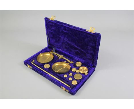 A Set of Indian Brass Postal scales. The scales presented in the original velvet box with associated weights.