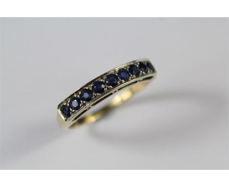 A Ladies 9ct Yellow Gold and Sapphire Ring. The ring set with approx 9 x 2.5mm sapphires, size R+,&nbsp; &nbsp; approx 3.1 gm