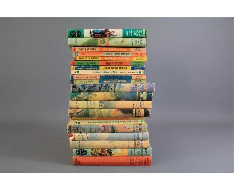 Twenty One Vintage 'Biggles' Books. The lot includes some first edition in the original dustjackets.