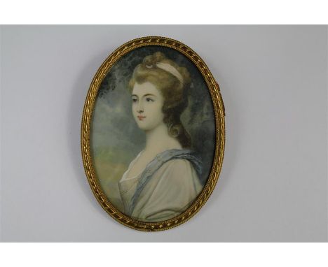 An Antique Portrait Miniature. The oval miniature painted on ivory depicting a noblewoman, approx 60 x 90 mm, presented in a 