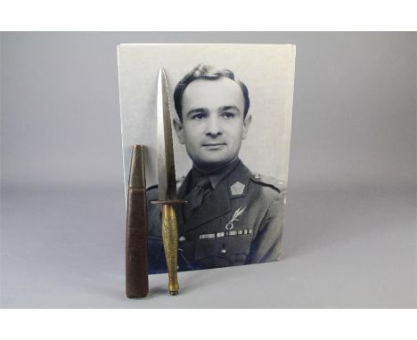 Fairbairn Sykes WWII 2nd Pattern Commando Knife. The knife having a chequered brass grip,  oval guard with a vague arrow and 