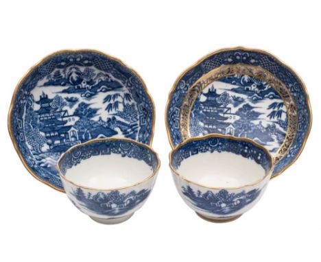 A pair of Caughley blue and white tea bowls and saucers: printed and gilded with the 'Pagoda' pattern, S and X marks, circa 1