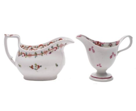 A Newhall famille rose hardpaste cream jug and one similar: the first of pedestal helmet shape, painted in iron-red, green an