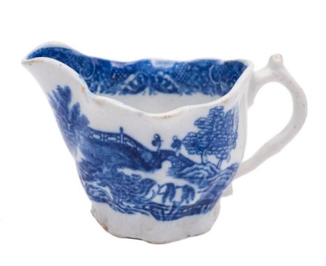 A Caughley blue and white 'low chelsea ewer' cream jug: printed with the chinoiserie 'Pagoda' pattern, circa 1785-90, 11 cm w