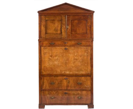 A 19th Century Continental elm secretaire a abbatant:, in two sections, the upper part with a moulded architectural pediment 