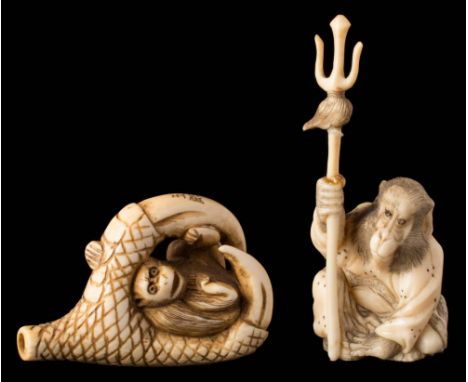 A Japanese carved ivory netsuke: depicting a monkey held within a bird's talons, signed, 4.5cm. high, together with another s