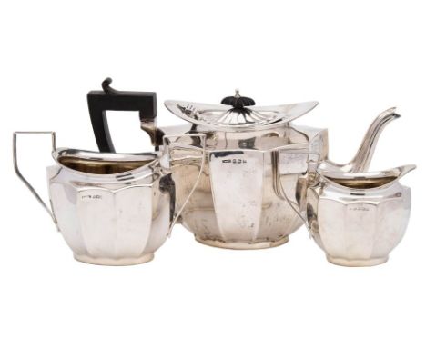 A George V three-piece silver tea set, maker F H Adams &amp; Co, Birmingham, 1921: of oval outline with inverted lobed panels