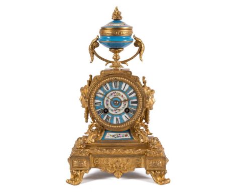 A 19th century French gilt-metal and porcelain French 19th century mantel clock: the eight-day duration movement striking the