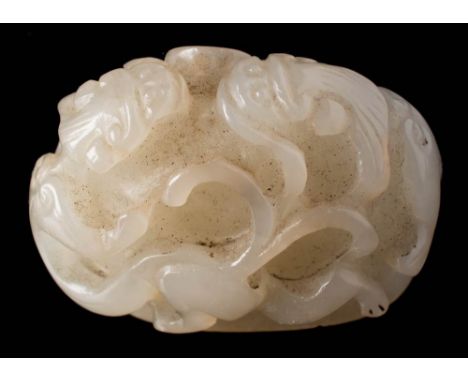 A Chinese jade 'chilong' carving: of domed form carved overall with two opposing chilong, the stone of pale celadon colour, t