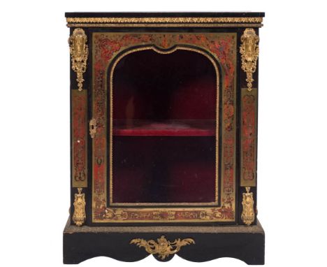 A 19th Century French ebonised and gilt metal mounted pier cabinet:, veneered in scarlet tortoiseshell and inlaid with a marq