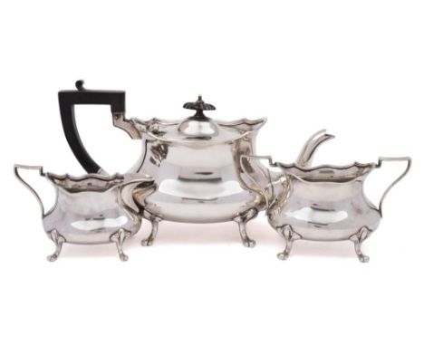 A George V silver three-piece tea service, maker Cooper Brothers & Sons, Sheffield, 1930/32/33: of squat oval form raised on 